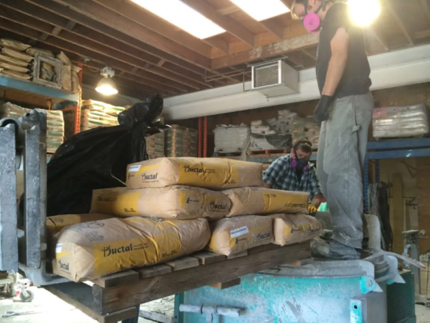 Ductal being poured into the board-formed mold in the Szolyd shop