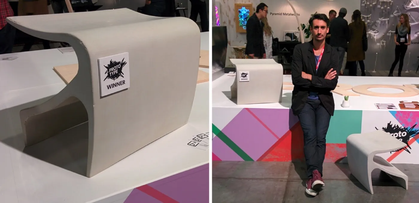 Cristian Arostegui standing with the Sofi bench at the Prototype exhibit, IDS West Vancouver