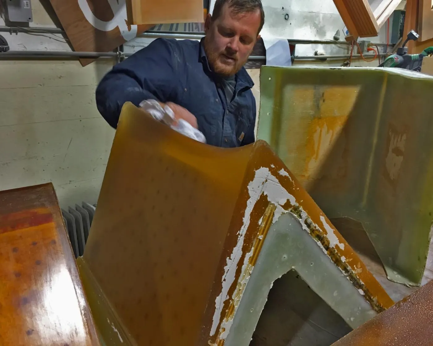 The full-size mold for the Sofi bench in the shop, its curved cavity ready for the pour